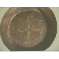 Rounded swastika design at the bottom of a vessel